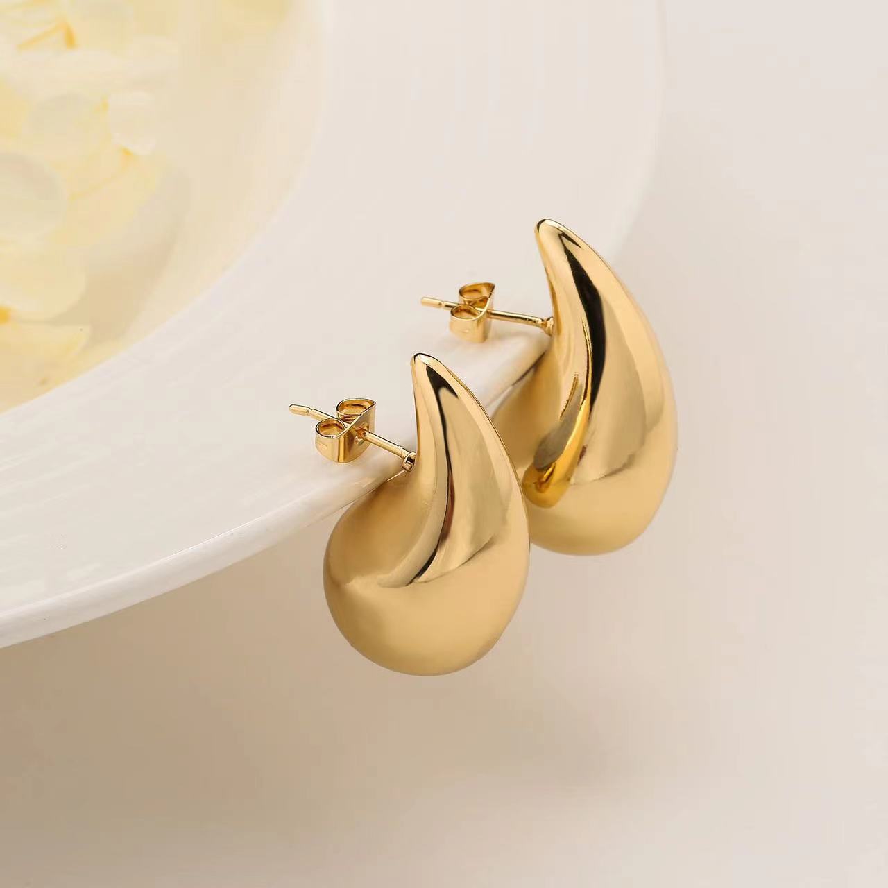 Topos dorados para mujer