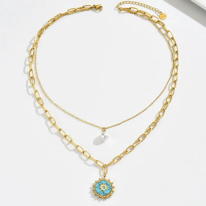 Collar Doble con Dijes Turquesa y Perla.