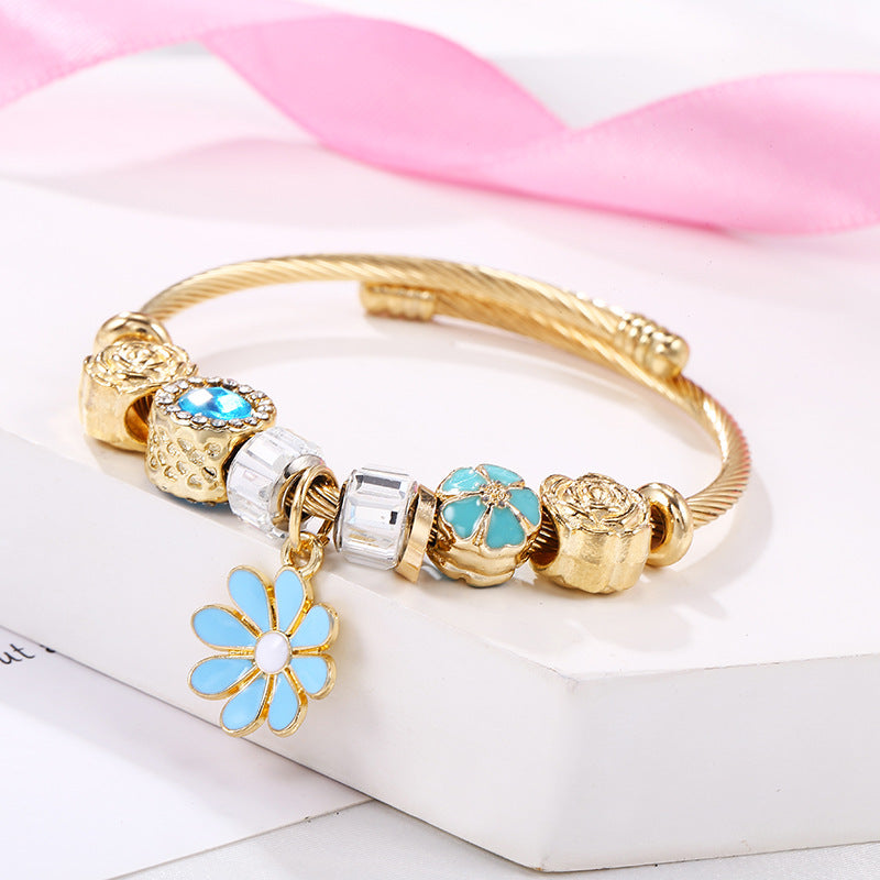 Pulsera Dorada Multidijes Margarita Azul Claro