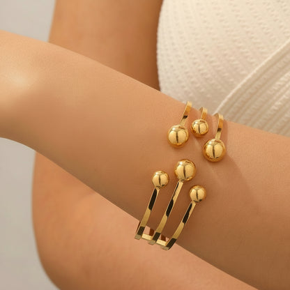 brazalete dorado con esferas