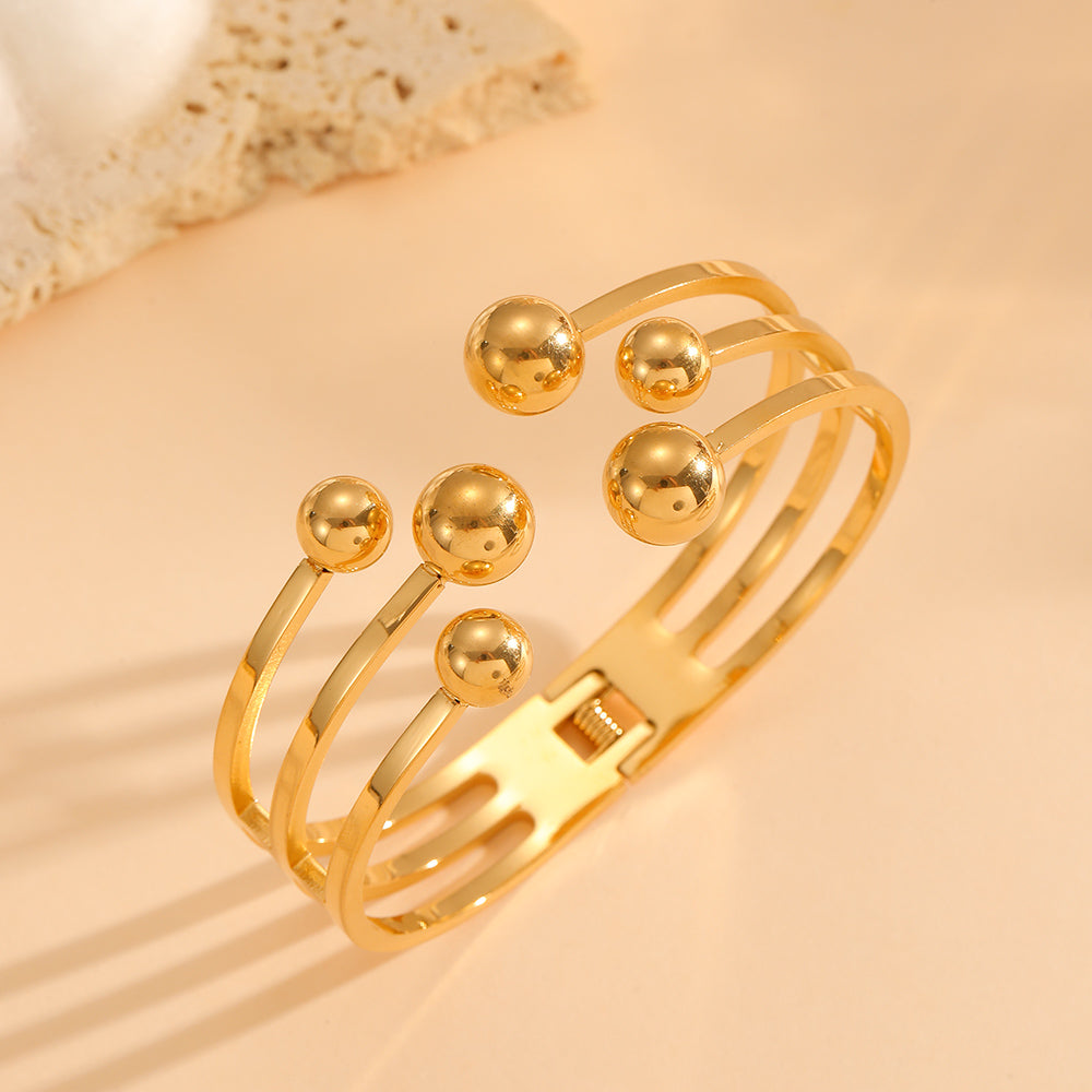 Brazalete Dorado Elegante con Esferas