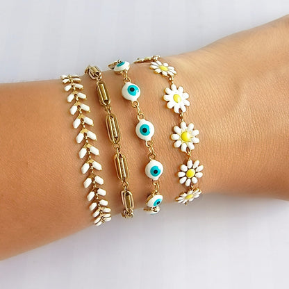set pulseras mujer margaritas ojo turco doradas Brownika Accesorios