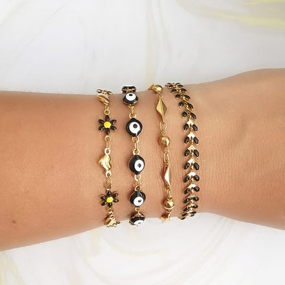 set pulseras mujer ojo turco flores negras doradas Brownika Accesorios